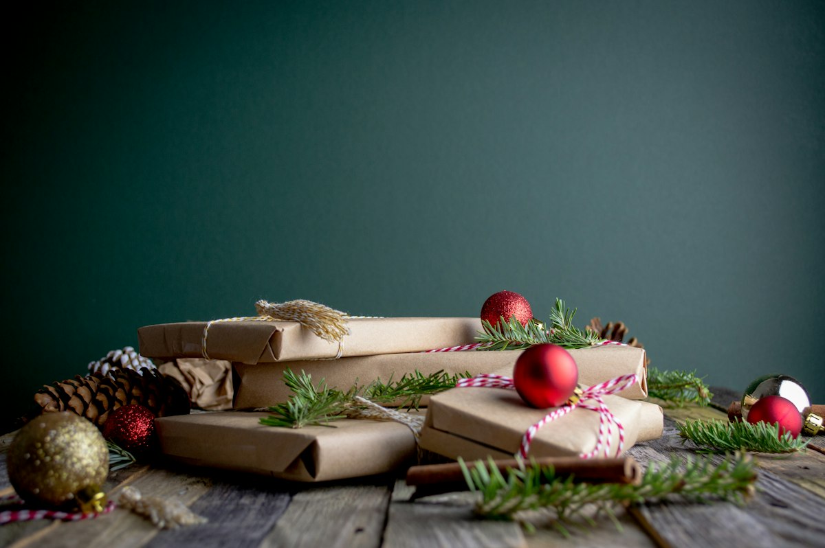 Gift boxes topped with red baubles